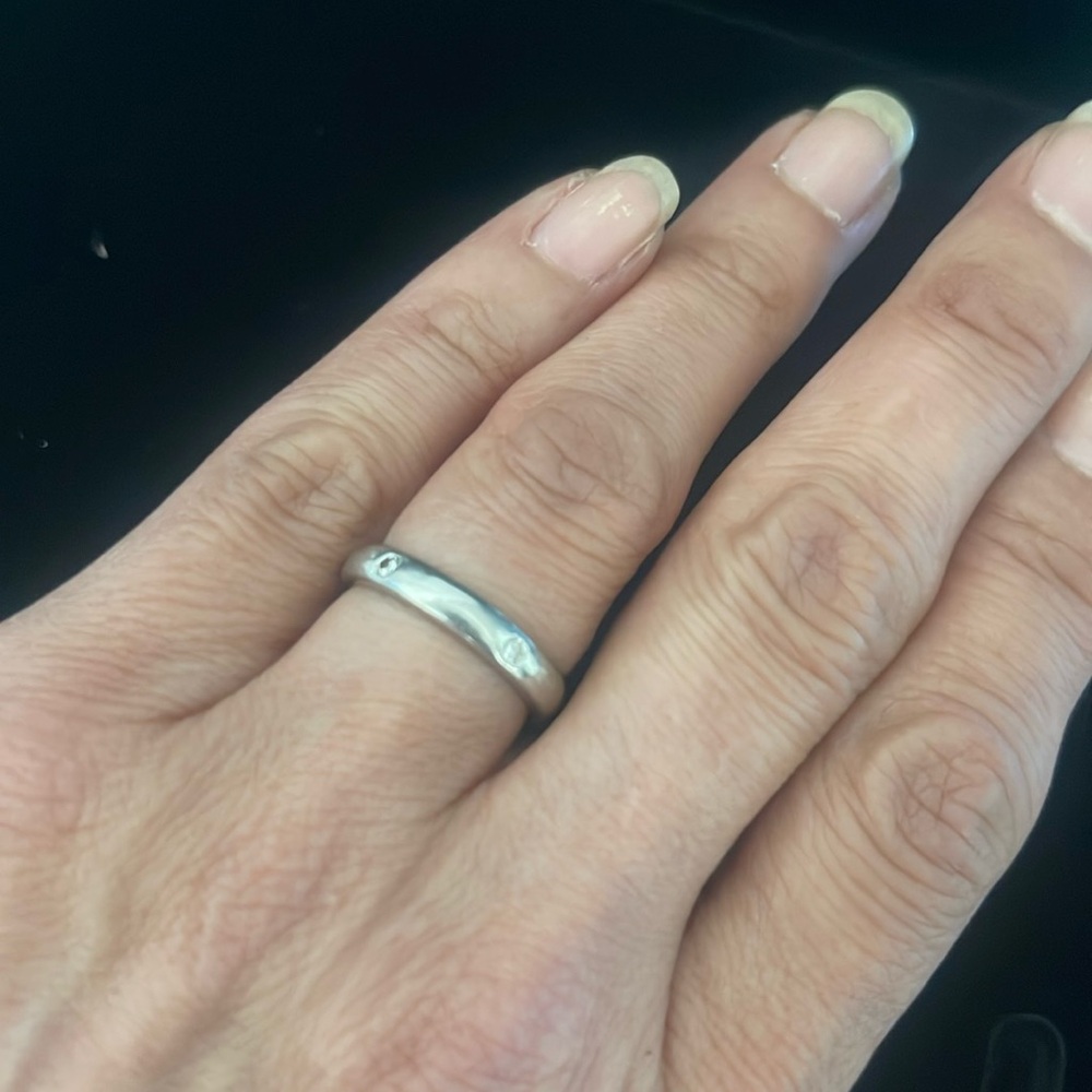 Size 7 1/2 Platinum Ring with 5 inset diamonds from La Maison D”or
